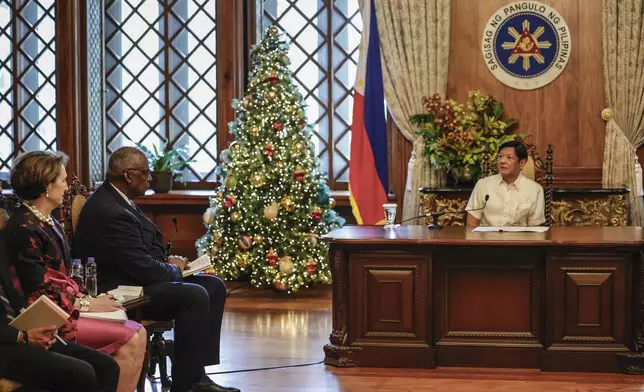 Philippine President Ferdinand Marcos Jr., right, meets with U.S. Defense Secretary Lloyd Austin and his delegation at the Malacanang Palace in Manila, Philippines Monday, Nov. 18, 2024. (AP Photo/Gerard Carreon, Pool)