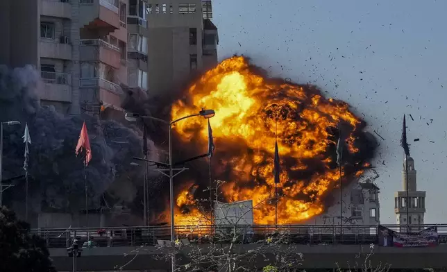 Thick smoke and flames erupt from an Israeli airstrike on Tayouneh, Beirut, Lebanon, Friday, Nov. 15, 2024. (AP Photo/Hassan Ammar)