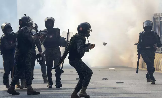 Paramilitary soldiers fire tear gas shells to disperse supporters of imprisoned former premier Imran Khan's Pakistan Tehreek-e-Insaf party, during clashes, in Islamabad, Pakistan, Tuesday, Nov. 26, 2024. (AP Photo/Irtisham Ahmed)