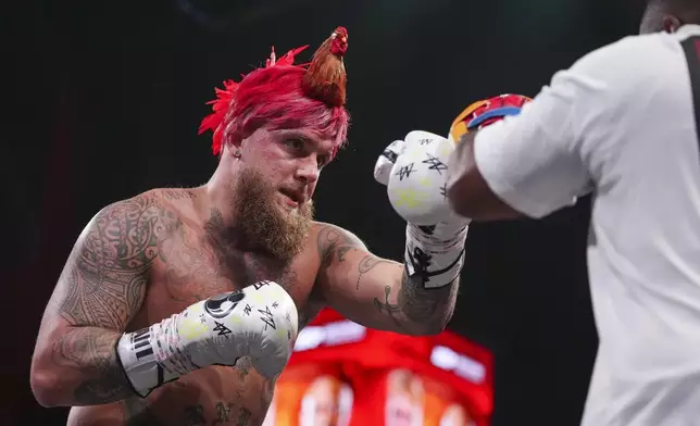 Jake Paul works out ahead of his boxing match against Mike Tyson, Tuesday, Nov. 12, 2024, in Irving, Texas. (AP Photo/Julio Cortez)