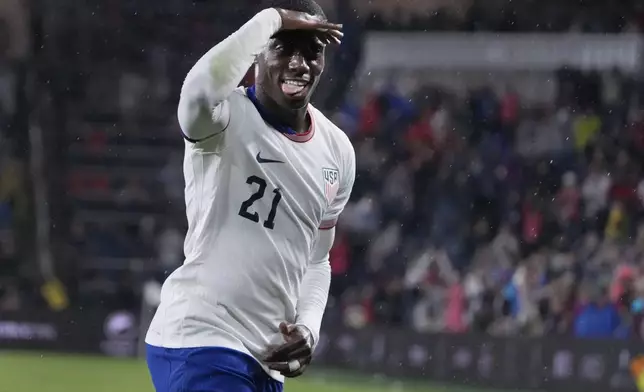 United States' Tim Weah (21) celebrates after scoring during the second half in a CONCACAF Nations League quarterfinal second leg soccer match against Jamaica Monday, Nov. 18, 2024, in St. Louis. (AP Photo/Jeff Roberson)