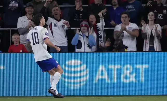 United States' Christian Pulisic (10) celebrates after scoring during the first half in a CONCACAF Nations League quarterfinal second leg soccer match against Jamaica Monday, Nov. 18, 2024, in St. Louis. (AP Photo/Jeff Roberson)