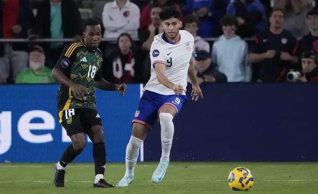 United States' Ricardo Pepi (9) and Jamaica's Tyreek Magee (18) chase after a loose ball during the first half in a CONCACAF Nations League quarterfinal second leg soccer match Monday, Nov. 18, 2024, in St. Louis. (AP Photo/Jeff Roberson)