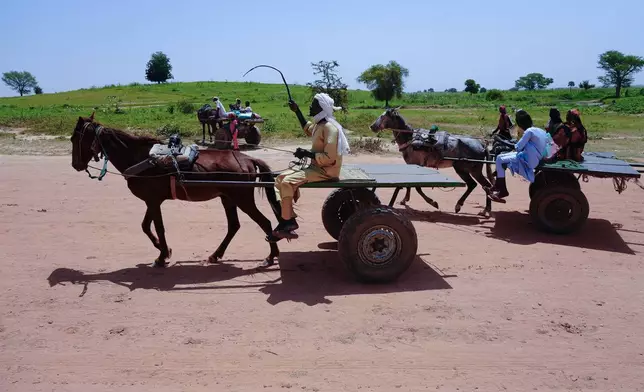 People cross into Chad from Sudan in Adre, Chad, Sunday, Oct. 6, 2024. (AP Photo/Sam Mednick)