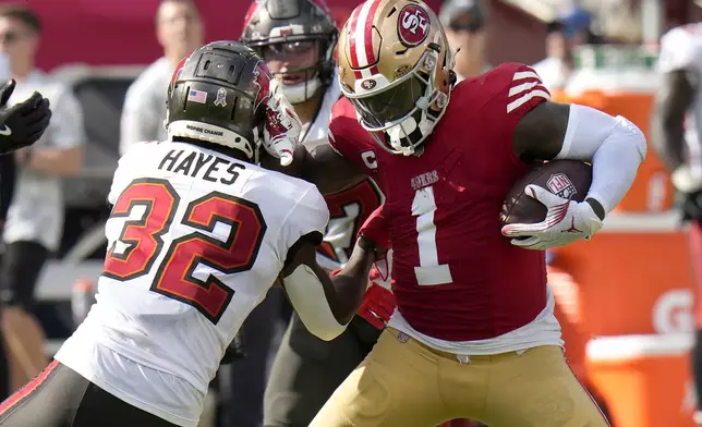 San Francisco 49ers wide receiver Deebo Samuel Sr. (1) runs against Tampa Bay Buccaneers safety Josh Hayes (32) during the second half of an NFL football game in Tampa, Fla., Sunday, Nov. 10, 2024. (AP Photo/Chris O'Meara)