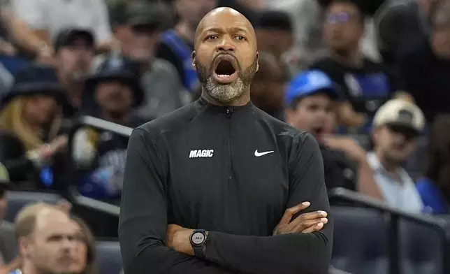 Orlando Magic head coach Jamahl Mosley calls out to players during the first half of an NBA basketball game against the Indiana Pacers, Wednesday, Nov. 13, 2024, in Orlando, Fla. (AP Photo/John Raoux)