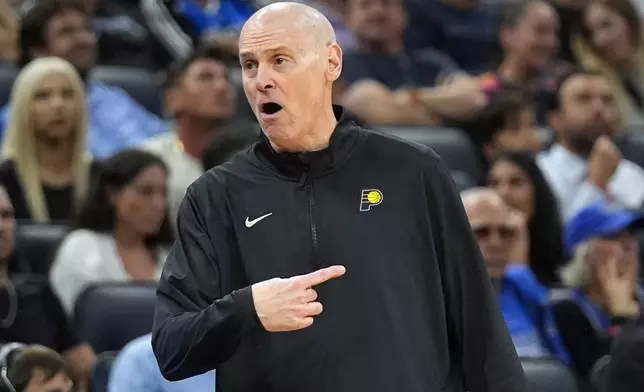 Indiana Pacers head coach Rick Carlisle directs his players during the first half of an NBA basketball game against the Orlando Magic, Wednesday, Nov. 13, 2024, in Orlando, Fla. (AP Photo/John Raoux)