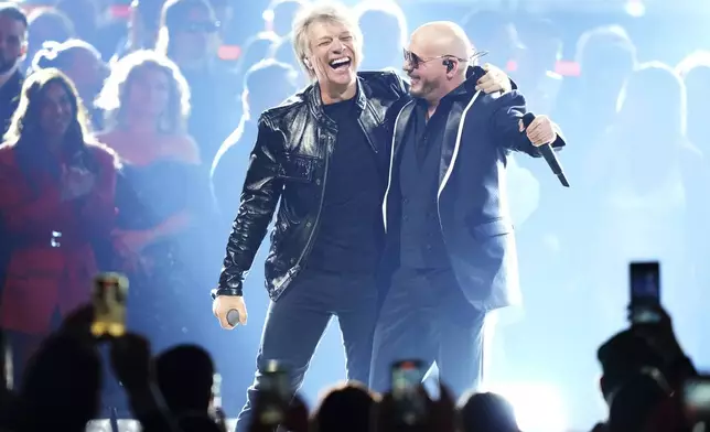 Pitbull and Jon Bon Jovi perform at the 25th Latin Grammy Awards ceremony, Thursday, Nov. 14, 2024, in Miami. (AP Photo/Lynne Sladky)