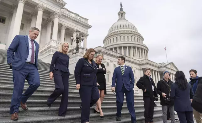 From left, Rep.-elect Jeff Hurd, R-Colo., Rep.-elect Kelly Morrison, D-Minn., Rep.-elect Julie Johnson, D-Texas, Rep.-elect April McClain Delaney, D-Md., and Rep.-elect Gabe Evans, R-Colo., walk down the steps of the Capitol, Friday, Nov. 15, 2024, in Washington. (AP Photo/Mark Schiefelbein)