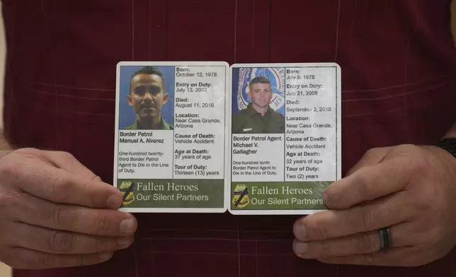 Border Patrol chaplain and instructor Jason Wilhite holds two Silent Partner cards he carries with him at all times showing two of his colleagues that died in the line of duty, Wednesday, Nov. 20, 2024, in Dania Beach, Fla. (AP Photo/Marta Lavandier)