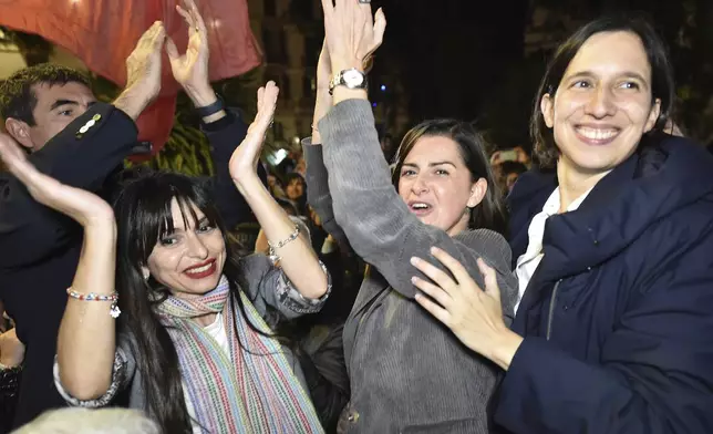 Center-left candidate Stefania Proietti, left, celebrates with Democratic Party leader Elly Schlein, right, following regional elections in the region of Umbria, in Perugia, Italy, late Monday, Nov. 18, 2024. (Roberto Settonce/LaPresse via AP)