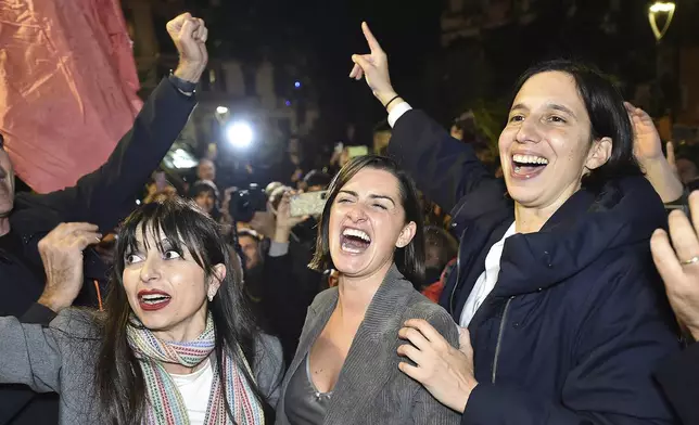 Center-left candidate Stefania Proietti, left, celebrates with Democratic Party leader Elly Schlein, right, following regional elections in the region of Umbria, in Perugia, Italy, late Monday, Nov. 18, 2024. (Roberto Settonce/LaPresse via AP)