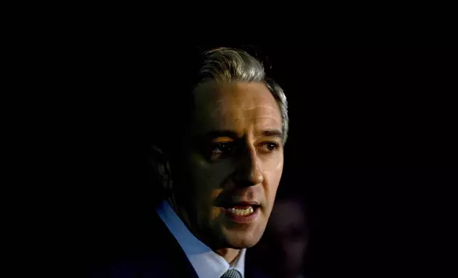 Irish Prime Minister and Fine Gael leader Simon Harris speaks to the media after casting his vote at Delgany National School, County Wicklow, as voters go to the polls for the 2024 General Election in Ireland, Friday Nov. 29, 2024. (Niall Carson/PA via AP)