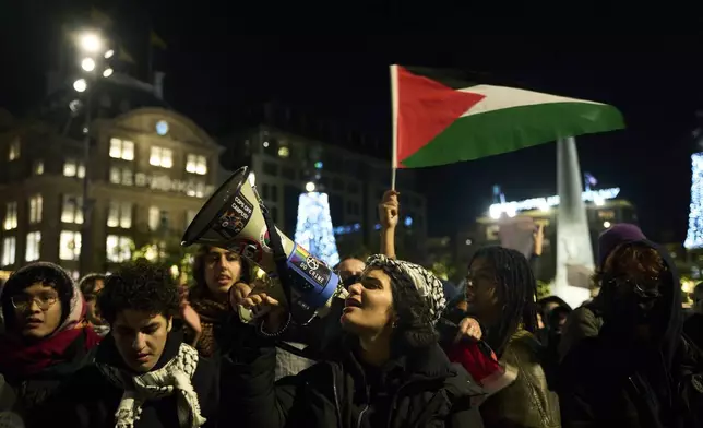 Pro-Palestinian supporters protest in Amsterdam, Netherlands, Wednesday, Nov. 13, 2024, despite a new city ban on such gatherings. (AP Photo/Bram Janssen)