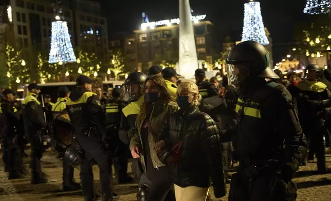 Pro-Palestinian protestors are arrested by police at a demonstration in Amsterdam, Netherlands, Wednesday, Nov. 13, 2024. (AP Photo/Bram Janssen)