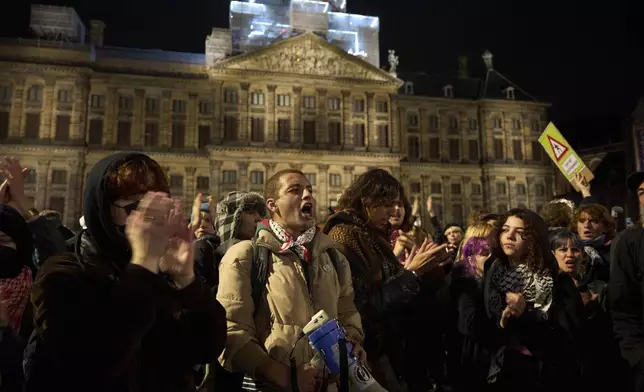 Pro-Palestinian supporters protest in Amsterdam, Netherlands, Wednesday, Nov. 13, 2024, despite a city ban on such gatherings. (AP Photo/Bram Janssen)