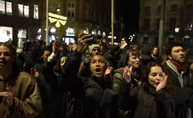 Pro-Palestinian supporters protest in Amsterdam, Netherlands, Wednesday, Nov. 13, 2024, despite a city ban on such gatherings. (AP Photo/Bram Janssen)