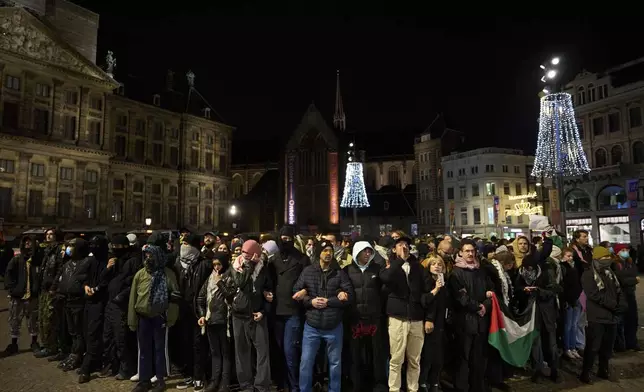 Pro-Palestinian supporters protest in Amsterdam, Netherlands, Wednesday, Nov. 13, 2024, despite a city ban on such gatherings. (AP Photo/Bram Janssen)