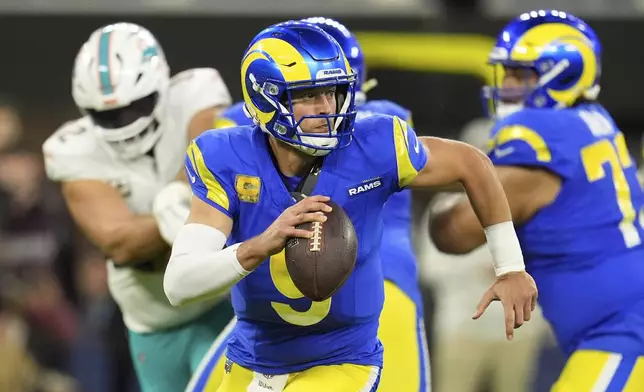 Los Angeles Rams quarterback Matthew Stafford scrambles with the ball during the first half of an NFL football game against the Miami Dolphins, Monday, Nov. 11, 2024, in Inglewood, Calif. (AP Photo/Marcio Jose Sanchez)