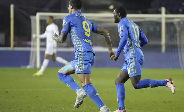 Empoli's Pietro Pellegri, left, celebrates after scoring during the Serie A soccer match between Empoli and Udinese at the Carlo Castellani Stadium in Empoli, Italy, Monday, Nov. 25, 2024. (Marco Bucco/LaPresse via AP)