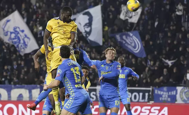 Udinese's Keinan Davis scores during the Serie A soccer match between Empoli and Udinese at the Carlo Castellani Stadium in Empoli, Italy, Monday, Nov. 25, 2024. (Marco Bucco/LaPresse via AP)