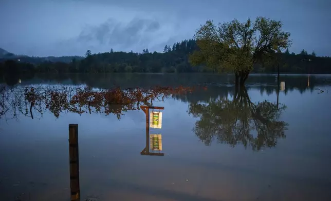 Property off River Road floods as the Russian River overflows in Sonoma County, Calif., on Friday, Nov. 22, 2024. (Santiago Mejia/San Francisco Chronicle via AP)