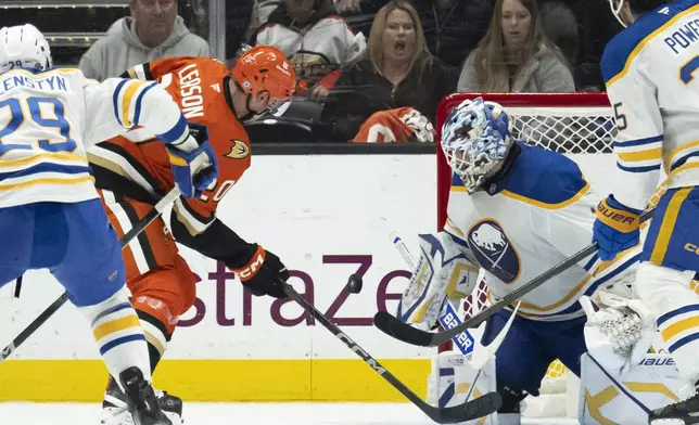 Buffalo Sabres goaltender Ukko-Pekka Luukkonen (1) blocks the shot by Anaheim Ducks right wing Brett Leason (20) during the second period of an NHL hockey game, Friday, Nov. 22, 2024, in Anaheim, Calif. (AP Photo/Kyusung Gong)