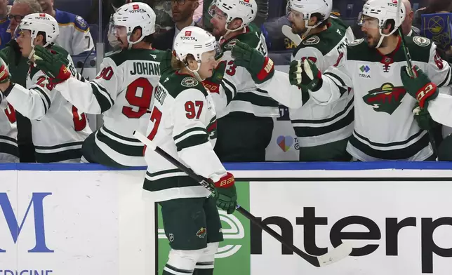 Minnesota Wild left wing Kirill Kaprizov (97) celebrates his goal during the first period of an NHL hockey game against the Buffalo Sabres, Wednesday, Nov. 27, 2024, in Buffalo, N.Y. (AP Photo/Jeffrey T. Barnes)