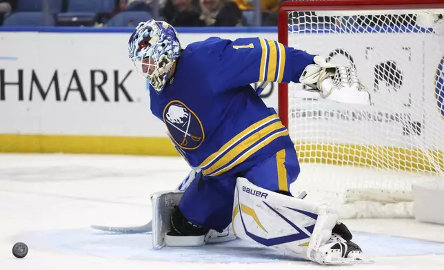 Buffalo Sabres goaltender Ukko-Pekka Luukkonen (1) makes a save during the second period of an NHL hockey game against the Minnesota Wild, Wednesday, Nov. 27, 2024, in Buffalo, N.Y. (AP Photo/Jeffrey T. Barnes)