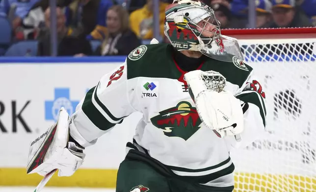 Minnesota Wild goaltender Filip Gustavsson (32) watches the puck go wide during the first period of an NHL hockey game against the Buffalo Sabres, Wednesday, Nov. 27, 2024, in Buffalo, N.Y. (AP Photo/Jeffrey T. Barnes)