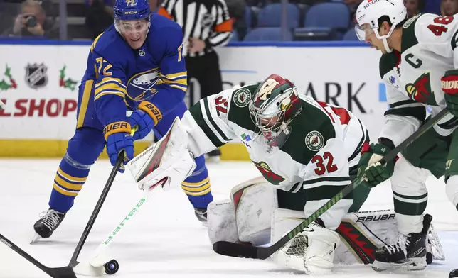 Buffalo Sabres center Tage Thompson (72) is stopped by Minnesota Wild goaltender Filip Gustavsson (32) during the first period of an NHL hockey game Wednesday, Nov. 27, 2024, in Buffalo, N.Y. (AP Photo/Jeffrey T. Barnes)