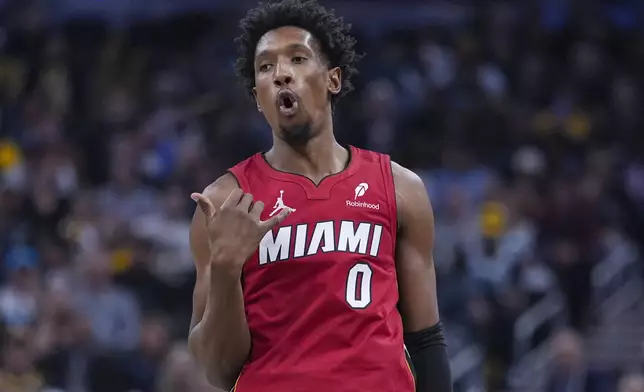 Miami Heat guard Josh Richardson reacts after a basket against the Indiana Pacers during the first half of an NBA basketball game in Indianapolis, Sunday, Nov. 17, 2024. (AP Photo/Michael Conroy)