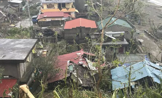 This photo provided by the MDRRMO Viga Catanduanes, shows damaged houses caused by Typhoon Man-yi in Viga, Catanduanes province, northeastern Philippines Sunday, Nov. 17, 2024. (MDRRMO Viga Catanduanes via AP)