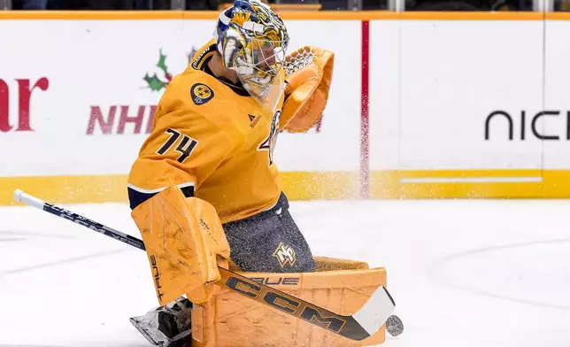 Nashville Predators goaltender Juuse Saros (74) blocks a shot on goal during the first period of an NHL hockey game against the Philadelphia Flyers, Wednesday, Nov. 27, 2024, in Nashville, Tenn. (AP Photo/George Walker IV)