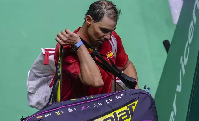 Spain's tennis player Rafael Nadal leaves the court after losing against Netherlands' Botic Van De Zandschulp during a Davis Cup quarterfinal match at Martin Carpena Sports Hall in Malaga, southern Spain, on Tuesday, Nov. 19, 2024. (AP Photo/Manu Fernandez)