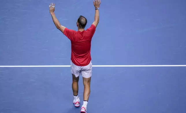 Spain's tennis player Rafael Nadal waves to the crowd after losing against Netherlands' Botic Van De Zandschulp during a Davis Cup quarterfinal match at Martin Carpena Sports Hall in Malaga, southern Spain, on Tuesday, Nov. 19, 2024. (AP Photo/Manu Fernandez)