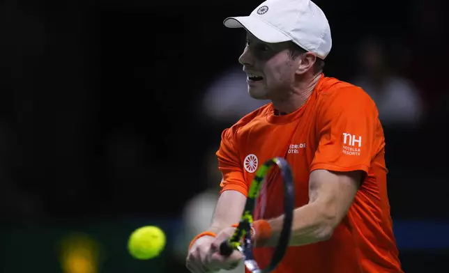 Netherlands' tennis player Botic Van De Zandschulp competes against Spain's Rafael Nadal during a Davis Cup quarterfinal match at Martin Carpena Sports Hall in Malaga, southern Spain, on Tuesday, Nov. 19, 2024. (AP Photo/Manu Fernandez)