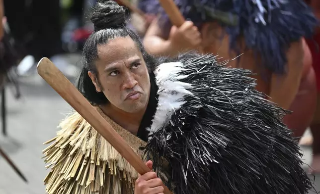 Indigenous Māori reacts outside New Zealand's parliament to protest against a proposed law that would redefine the country's founding agreement between Indigenous Māori and the British Crown, in Wellington, New Zealand, Tuesday, Nov. 19, 2024. (AP Photo/Mark Tantrum)