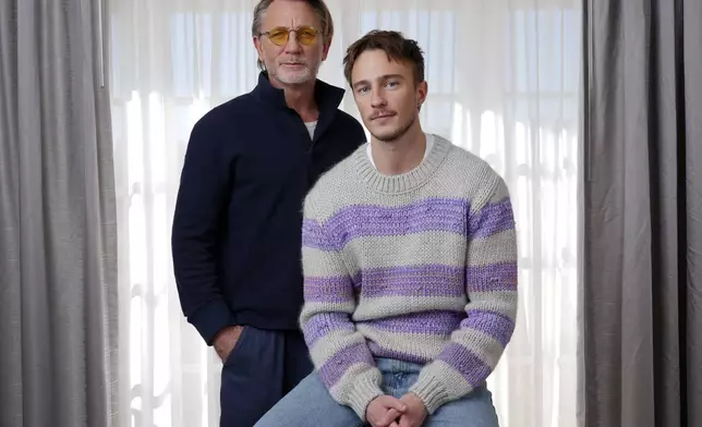 Daniel Craig, left, and Drew Starkey, cast members in the film "Queer," pose together for a portrait to promote the film on Wednesday, Nov. 13, 2024 in Los Angeles. (AP Photo/Chris Pizzello)