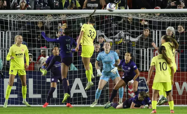 Washington Spirit forward Ashley Hatch (33) tries to head the ball into the goal during the second half of the NWSL championship against the Orlando Pride at CPKC Stadium, Saturday, November 23, 2024, in Kansas City, Mo. (AP Photo/Reed Hoffmann)