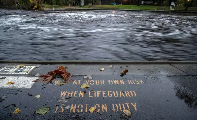 Big Chico Creek swirls by a swimming area at One Mile Recreation, runoff from Tuesday's rain and melting snow created flooding concerns as an atmospheric river storm dumped significant precipitation in Chico, Calif., Thursday, Nov. 21, 2024. (Carlos Avila Gonzalez/San Francisco Chronicle via AP)