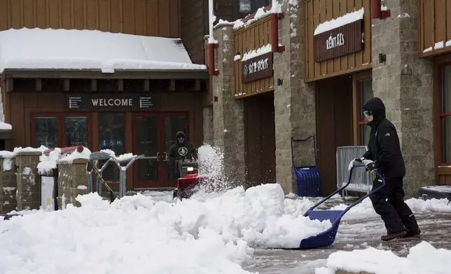 Workers clear walking paths with snow blowers during a storm Thursday, Nov. 21, 2024, at Sugar Bowl Ski Resort in Norden, Calif. (AP Photo/Brooke Hess-Homeier)