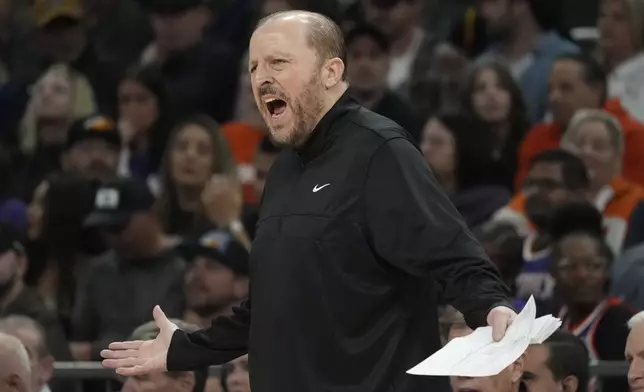 New York Knicks head coach Tom Thibodeau argues with officials during the first half of an NBA basketball game against the Phoenix Suns Wednesday, Nov. 20, 2024, in Phoenix. (AP Photo/Ross D. Franklin)