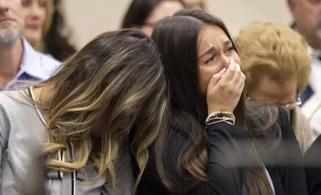 From left, Connolly Huth, roommate of Laken Riley, and Lauren Phillips, Riley's younger sister, become emotional during the trial for Jose Ibarra at the Athens-Clarke County Superior Court on Tuesday, Nov. 19, 2024, in Athens, Ga. (Arvin Temkar/Atlanta Journal-Constitution via AP, Pool)