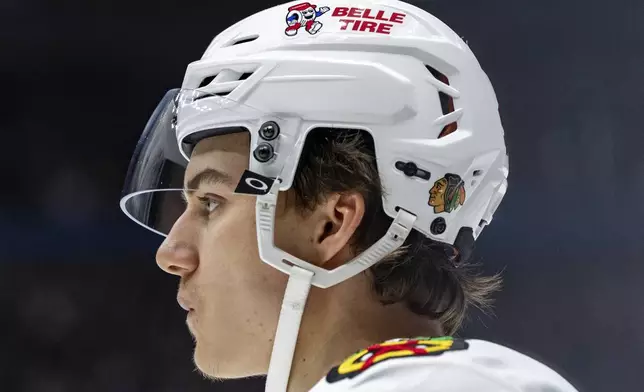 Chicago Blackhawks' Connor Bedard (98) waits for a face off against the Vancouver Canucks during third period NHL hockey action in Vancouver, B.C., Saturday, Nov. 16, 2024. (Ethan Cairns/The Canadian Press via AP)