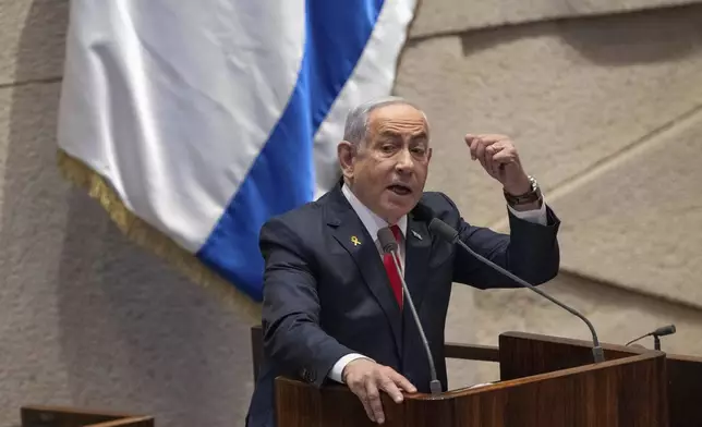 FILE - Israel's Prime Minister Benjamin Netanyahu addresses lawmakers in the Knesset, Israel's parliament, in Jerusalem. Monday Nov. 18, 2024. (AP Photo/Ohad Zwigenberg, File)