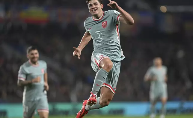 Atletico's Julian Alvarez celebrates after scoring the opening goal during the Champions League opening phase soccer match between between Sparta Prague and Athletico Madrid in Prague, Czech Republic, Tuesday, Nov. 26, 2024. (Michaela Rihova/CTK via AP)