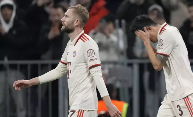 Bayern's Kim Min-jae, right, reacts after scoring the opening goal during the Champions League opening phase soccer match between FC Bayern and Paris Saint Germain, at the Allianz Arena in Munich, Germany, Tuesday, Nov. 26, 2024.(AP Photo/Matthias Schrader)