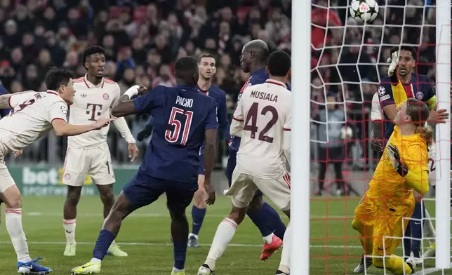 Bayern's Kim Min-jae, left, scores his side's opening goal during the Champions League opening phase soccer match between FC Bayern and Paris Saint Germain, at the Allianz Arena in Munich, Germany, Tuesday, Nov. 26, 2024.(AP Photo/Matthias Schrader)