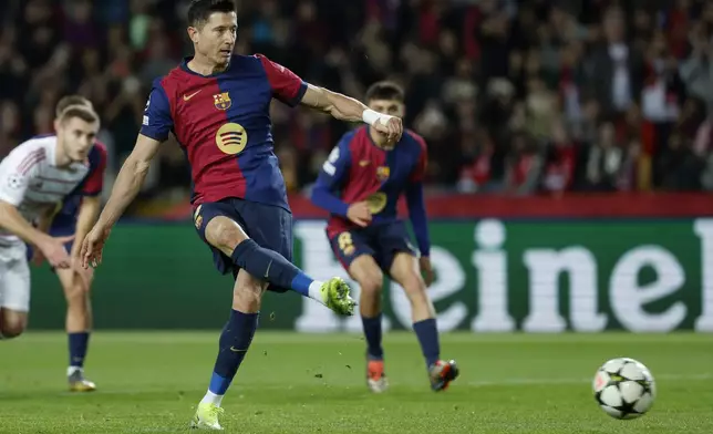 Barcelona's Robert Lewandowski shoots from the penalty spot to score his team's first goal during a Champions League phase soccer Matchday 5 between Barcelona and Brest at the Lluis Companys Olympic Stadium in Barcelona, Spain, Tuesday, Nov. 26, 2024. (AP Photo/Joan Monfort)